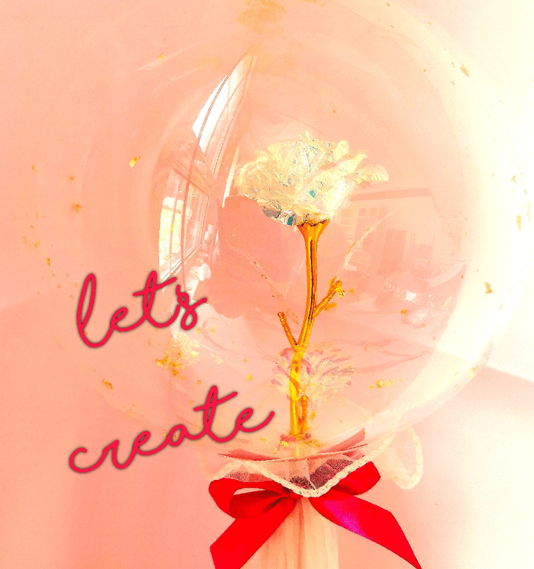 a clear glass vase with a flower inside