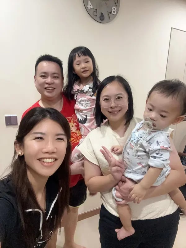 Young family celebrating their new home journey with the Lim Sisters property advisors