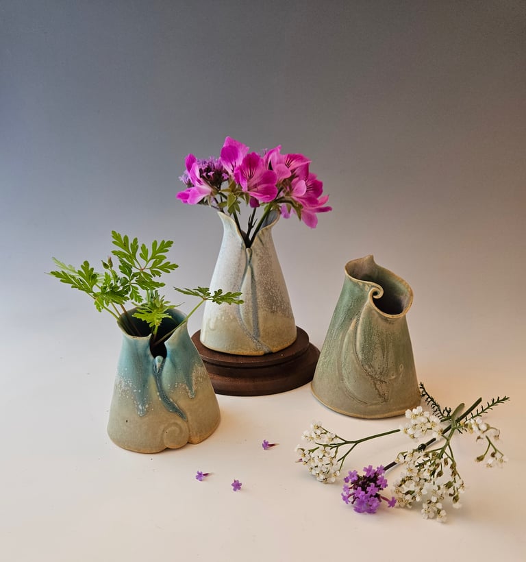 Posy Vases 3 to 4 in. high. Porcelain with microcrystalline glaze. Handbuilt. Highfired ^10.