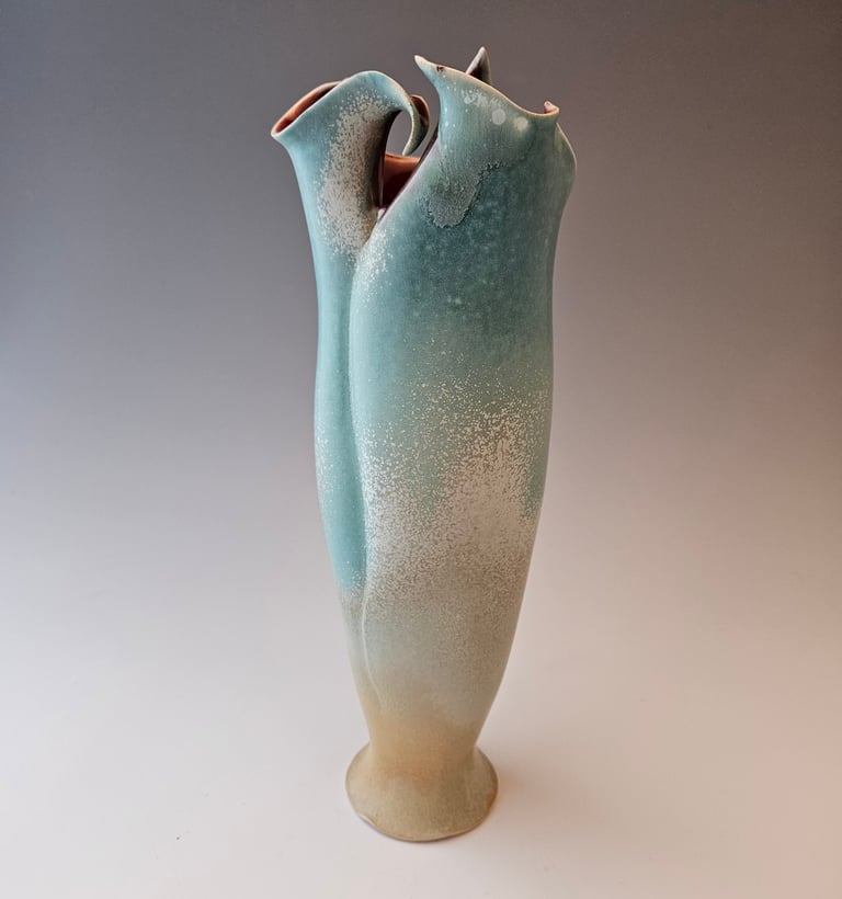 Tall Sharp Lily Vessel teal micro-crystalline exterior glaze with deep red glossy lining