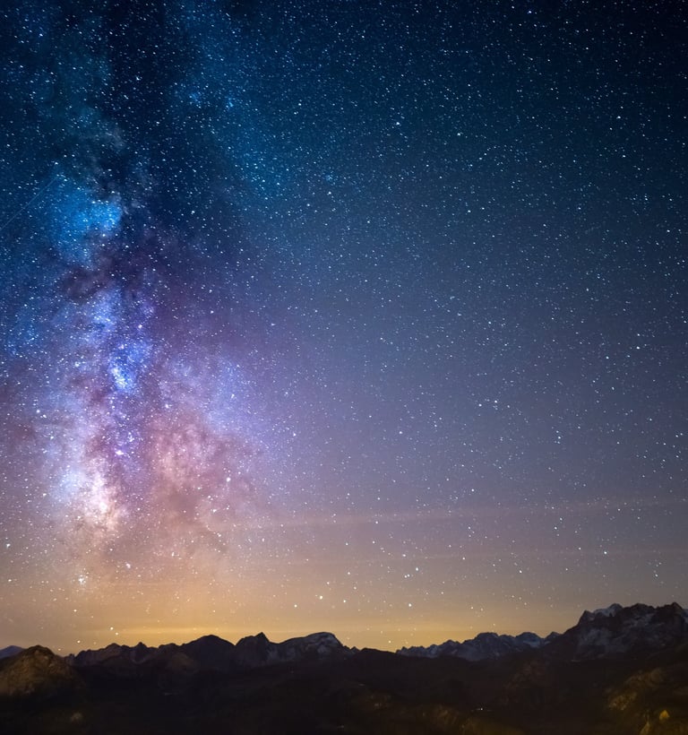 Milky Way galaxy over snowy mountains