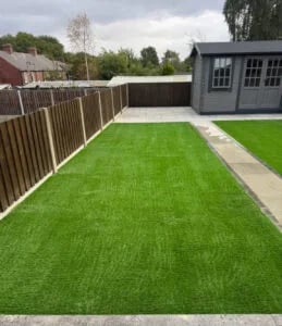Low maintenance garden ideas with artificial grass, gravel, and decking