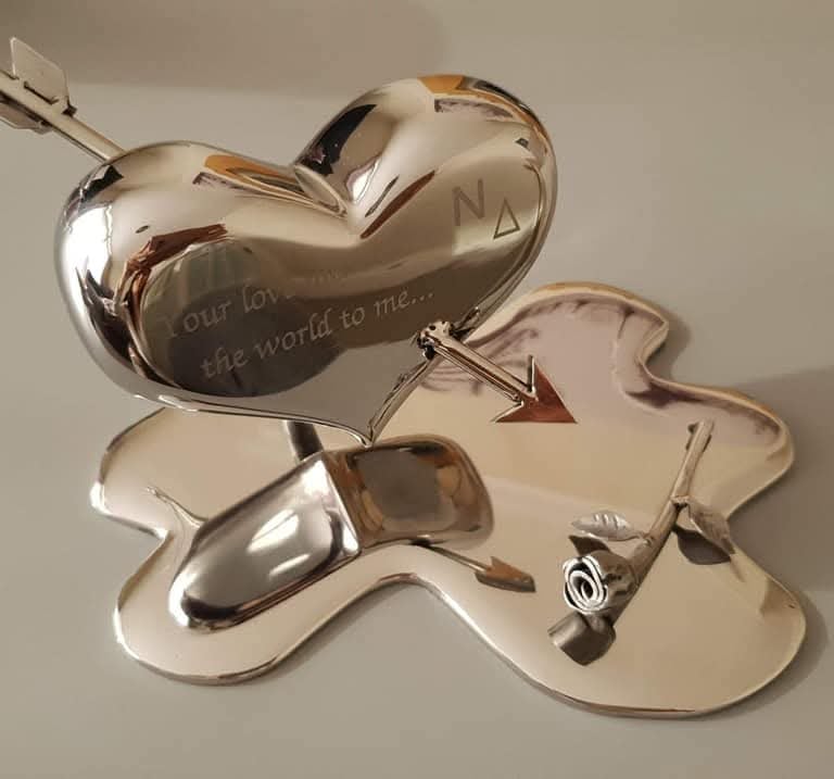 Polished metal love heart engraved with a personal message