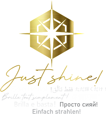 Gold MGG New York logo with pluralistic and inclusive 'Just Shine!' slogan in 8 languages.