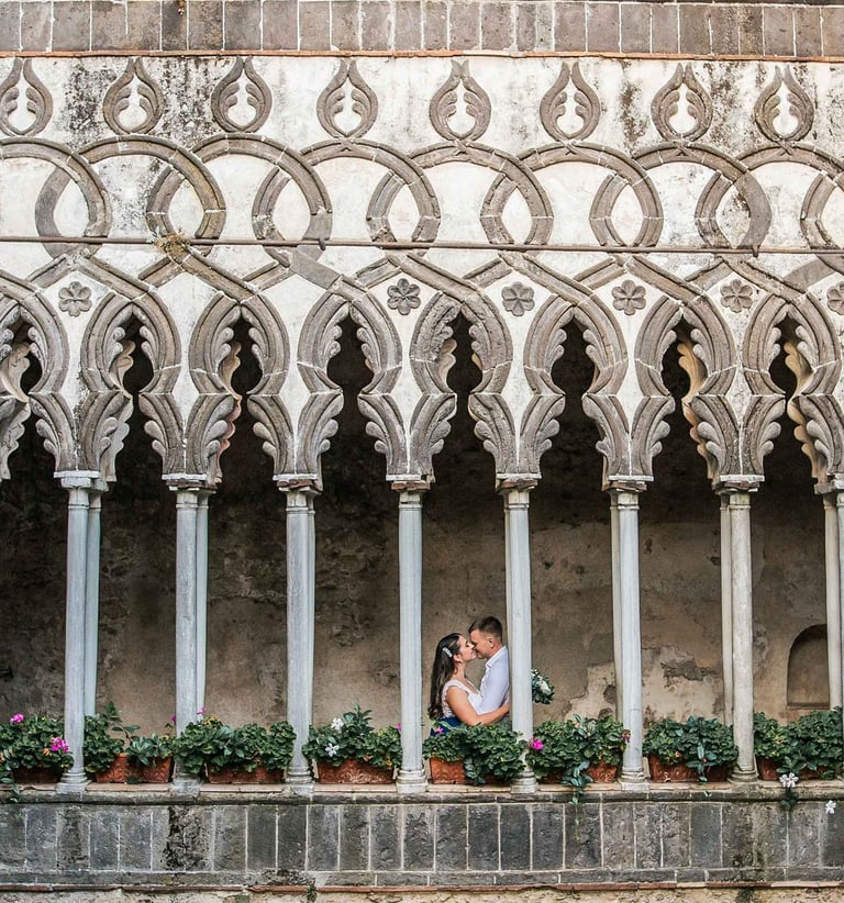a couple standing in front of a building