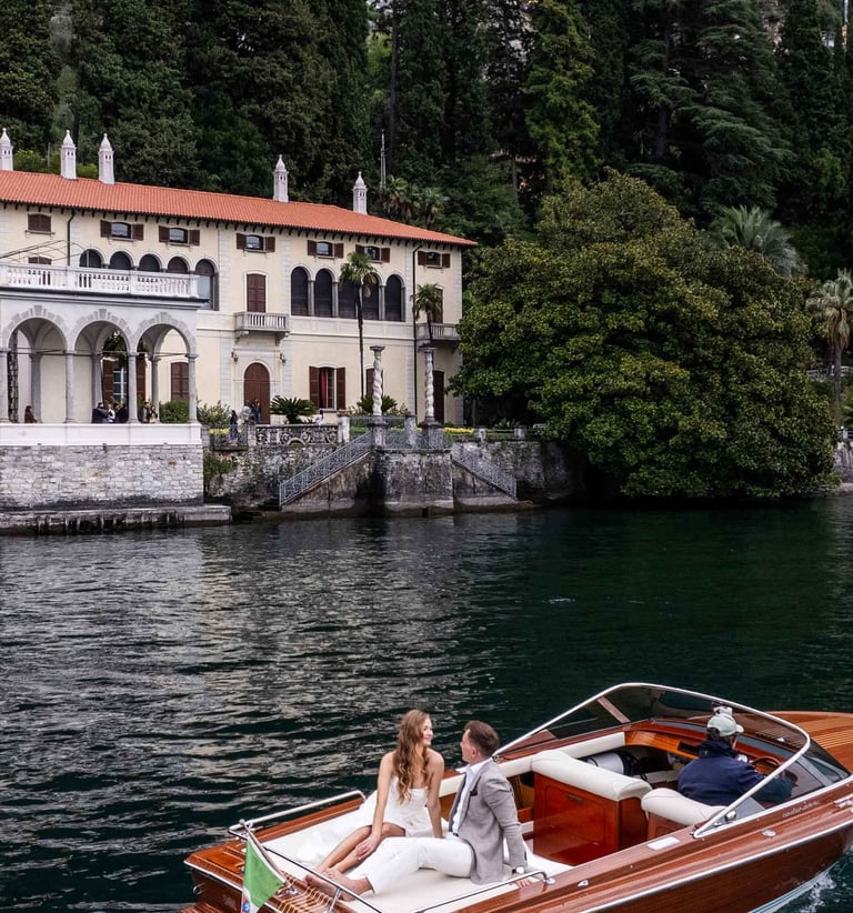 a boat on the water with a bride and groom