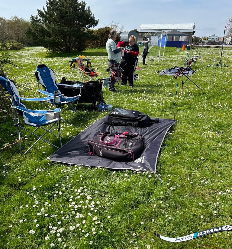 a group of archers getting ready to start shooting