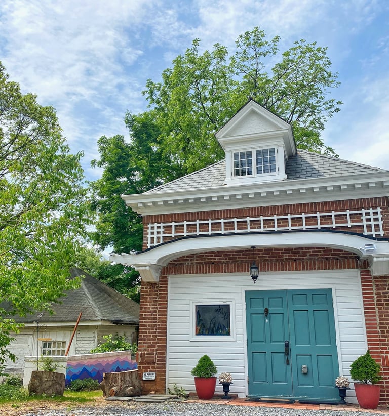 2123 rivermont carriage house with green door and white awning