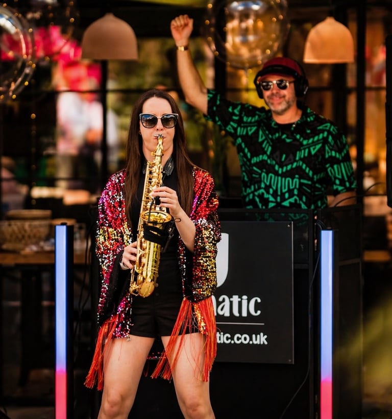 DJ and Sax, saxophonist dj combo in action at outdoor wedding.