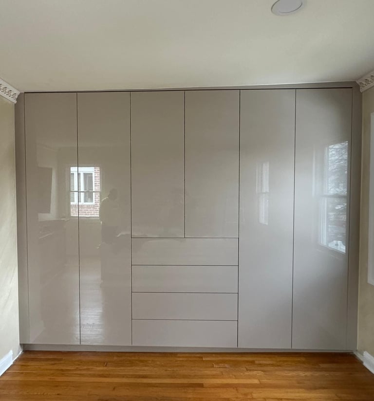 a room with a wooden floor and a white cupboard