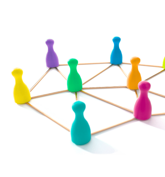 a group of colorful colored board game pawns in a circle connected by golden lines