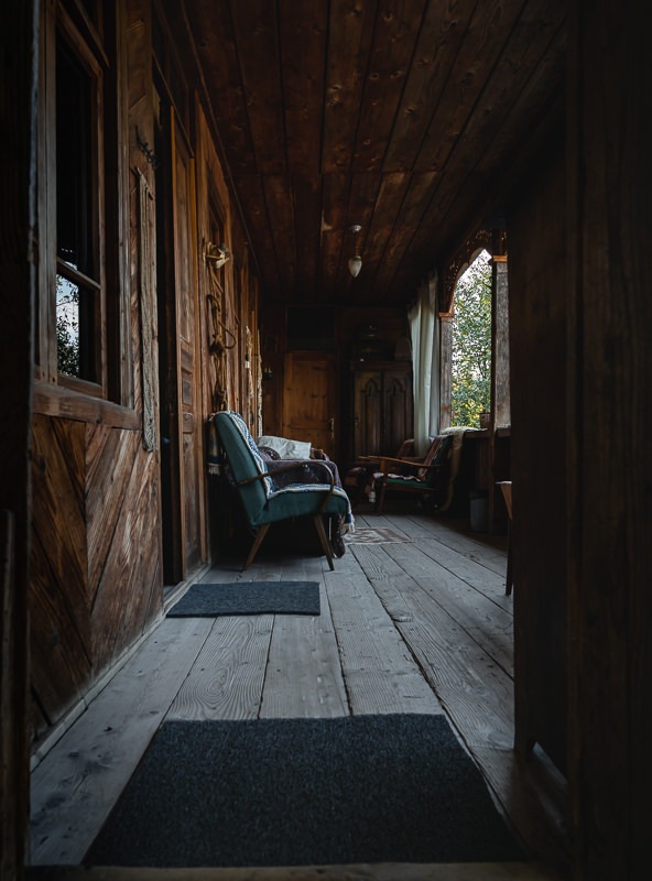 a chair in a room with a chair and a rug