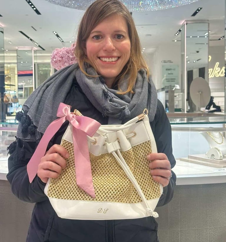 Happy client with her personalized leather bag by NYC calligrapher Handwritten by Belle.