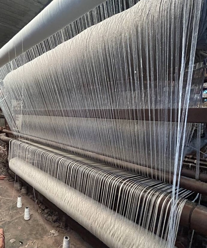 Handloom carpet in the making on a traditional loom