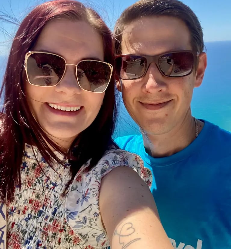 a man and woman taking a selfie with a selfie