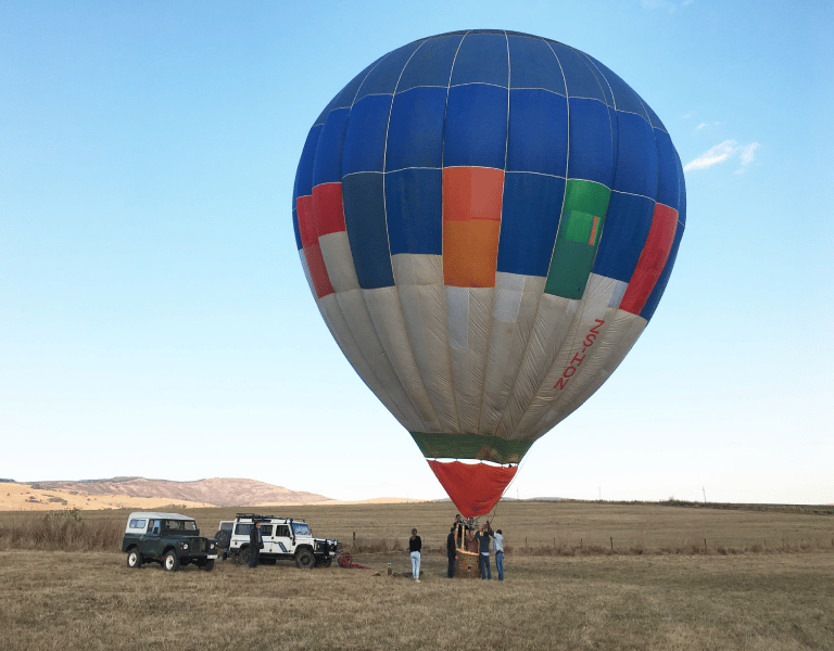 a hot air balloon in the middle of a field