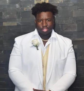 Calvin Avery dressed up for his senior prom, high school All American, Univ. of Illinois' DT 