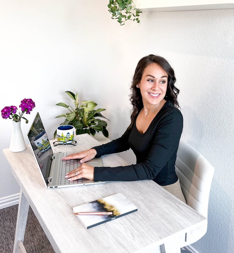 Professional writer at writing at a desk and smiling