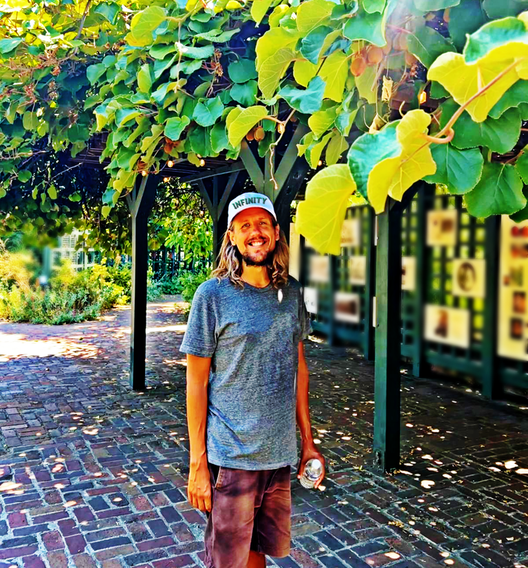 a healer man with a warm smile that is inviting and calming