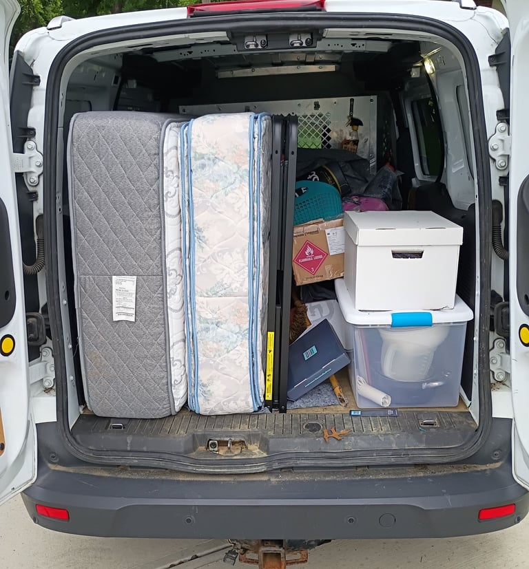 Van filled with decluttered items.  RevampT Spaces Organizing Services Decluttering near me