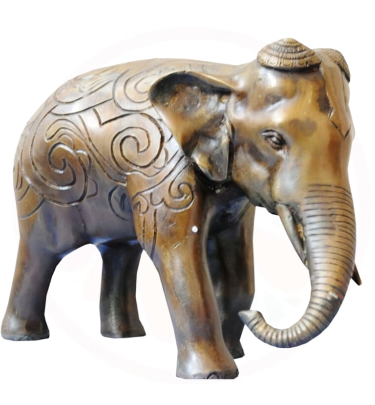 a statue of an elephant with a hat on
