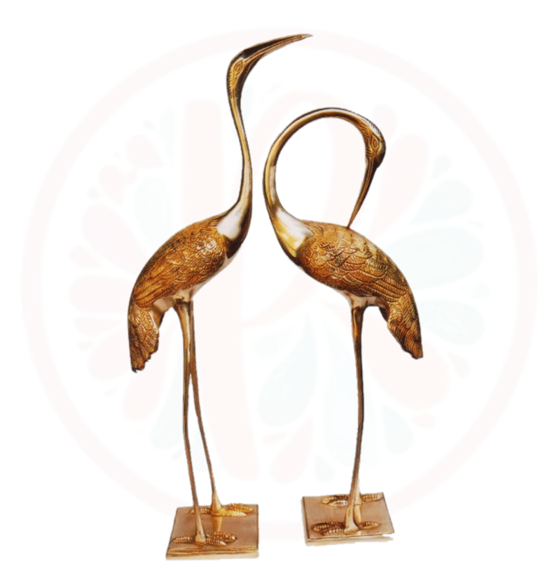 two large bronze colored birds on a stand