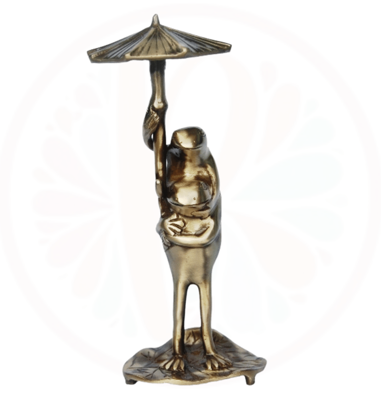 brass frog under a umbrella