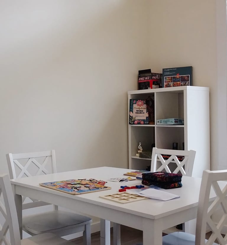 Fun and engaging games area in AFH facility designed to promote social interaction for residents.