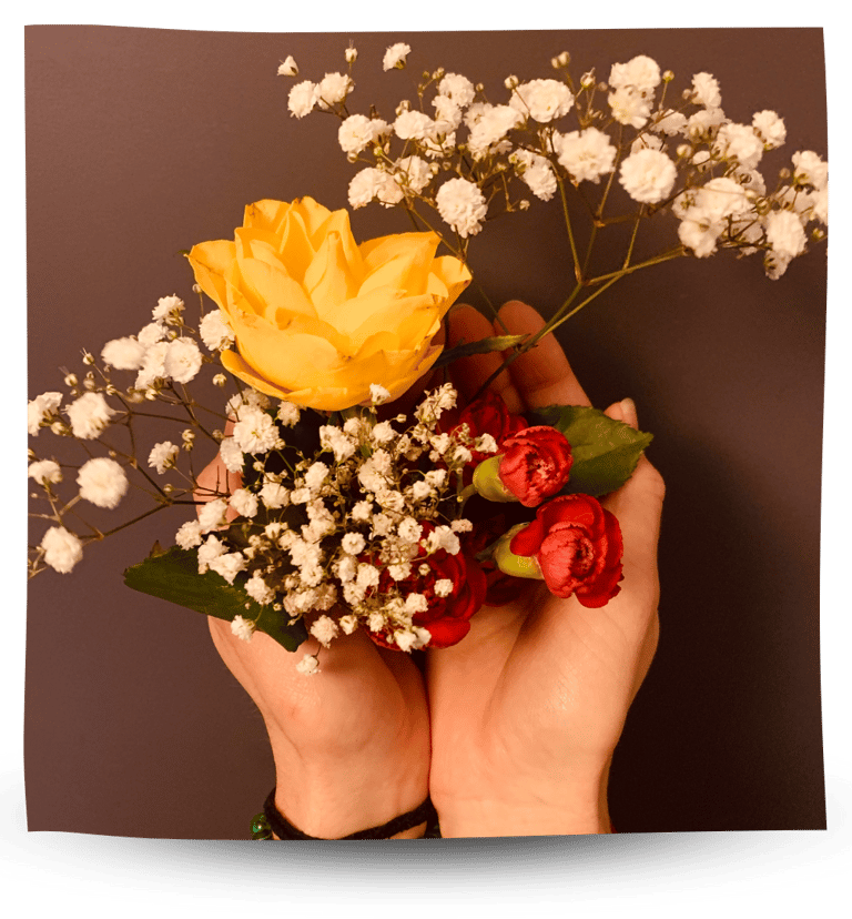 Martina holding flowers in her hands