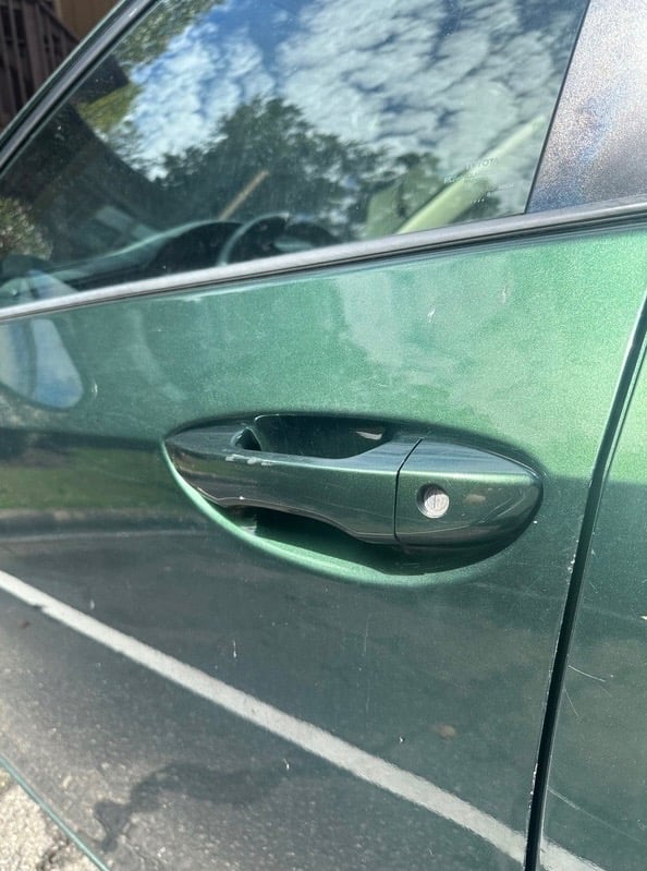 2016 Toyota Corolla door handle and lock on green car