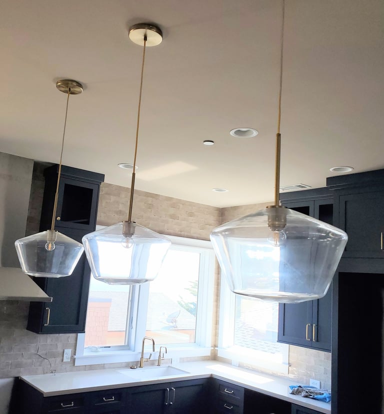 Custom kitchen island lighting. Modern kitchen renovations in Colorado Springs