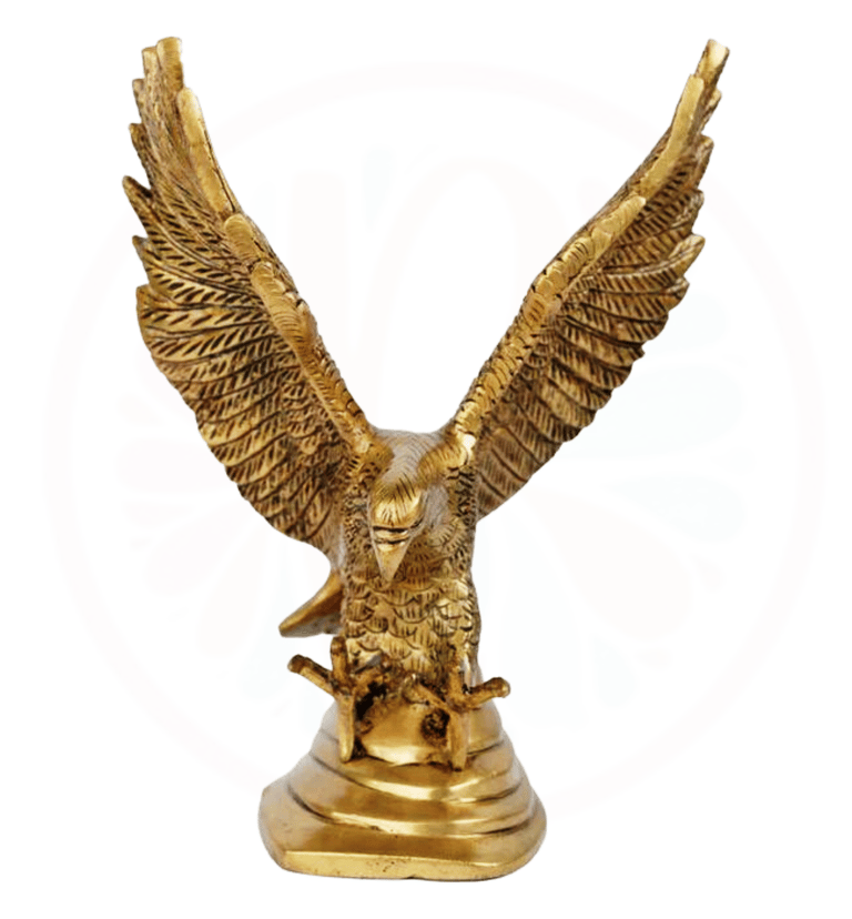 a golden eagle statue of a bird with a skull and a skull on it