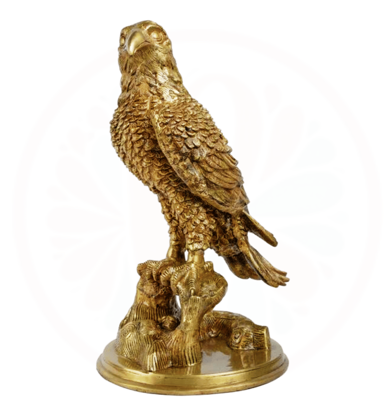 a golden eagle sitting on a tree stump