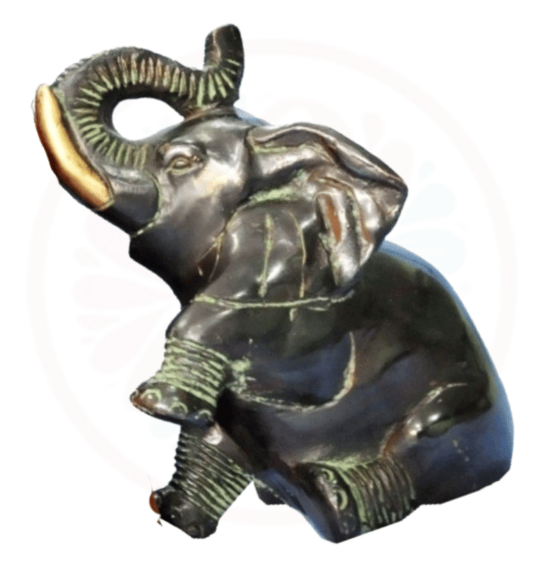 a statue of an elephant with a gold ring