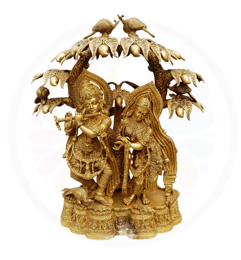 a gold radha krishna under tha mango tree