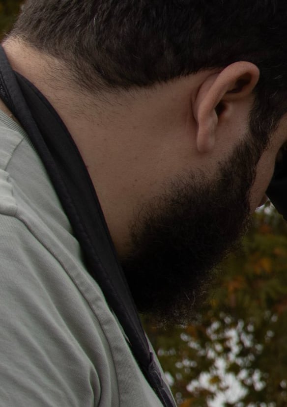 a man with a spotting scope and a spotting scopeon a tripod