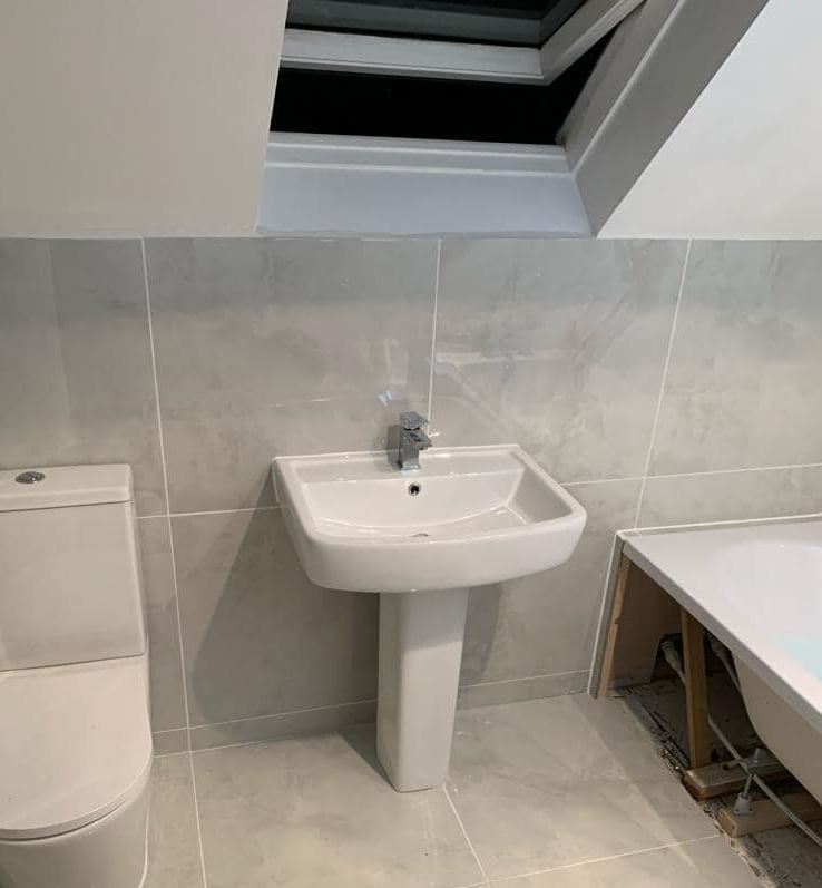 new toilet and sink fitted in a bathroom in worcester