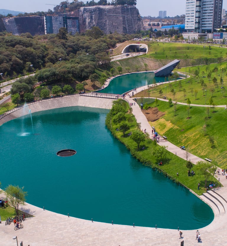 a large pond with a fountain and a fountain