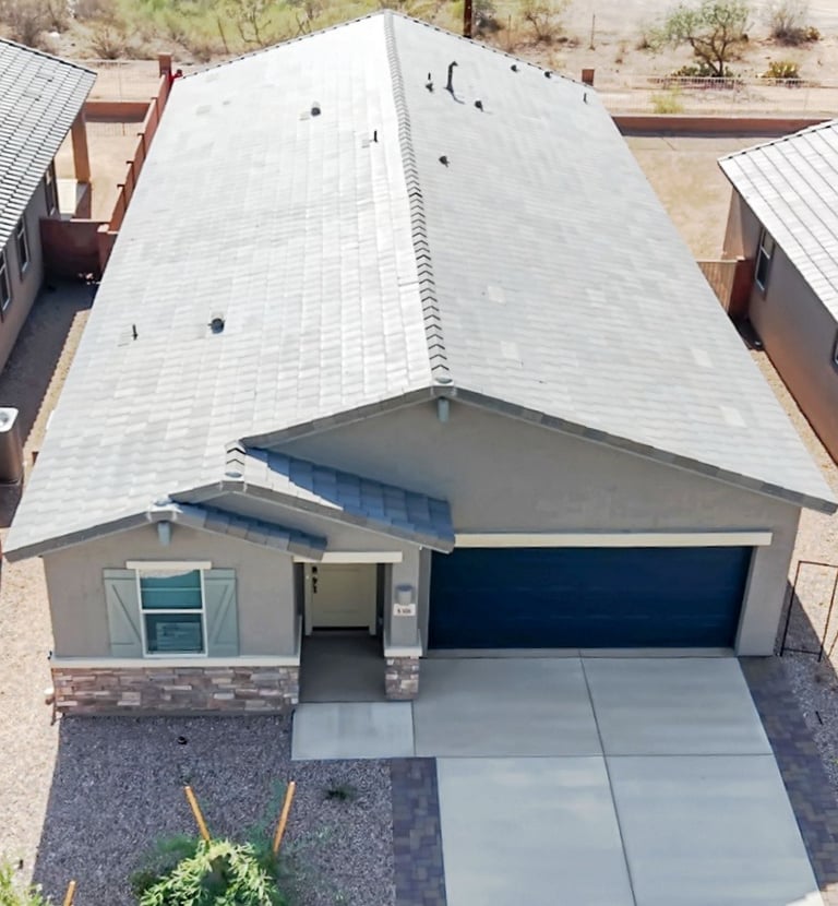 a house with a garage door and a garage door