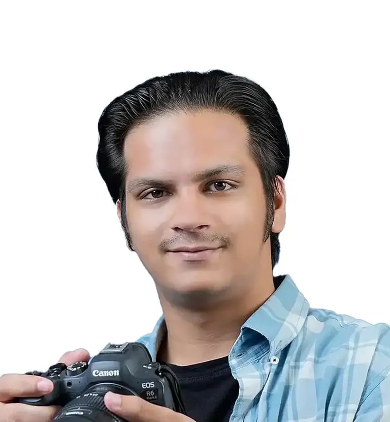 Bilal Photographer - a man holding a camera and taking a picture