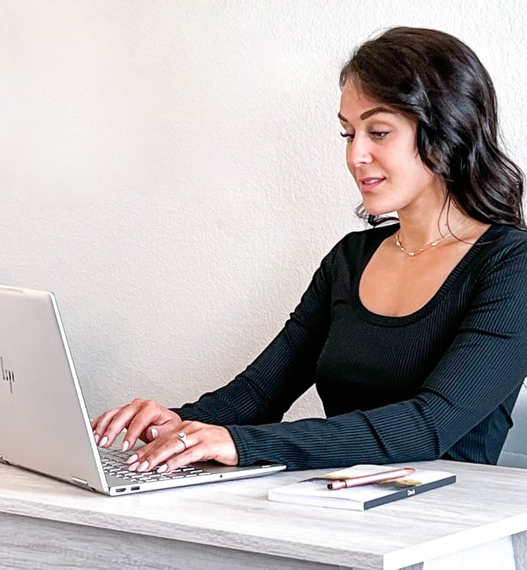 Woman writing at a desk