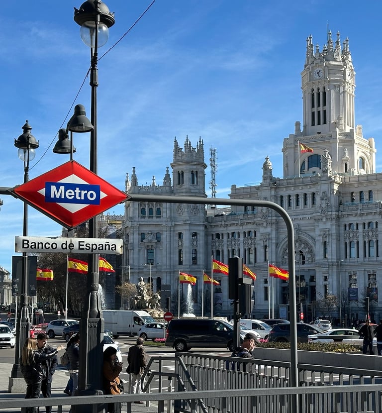 A Metro sign in front of Madrid City Hall
