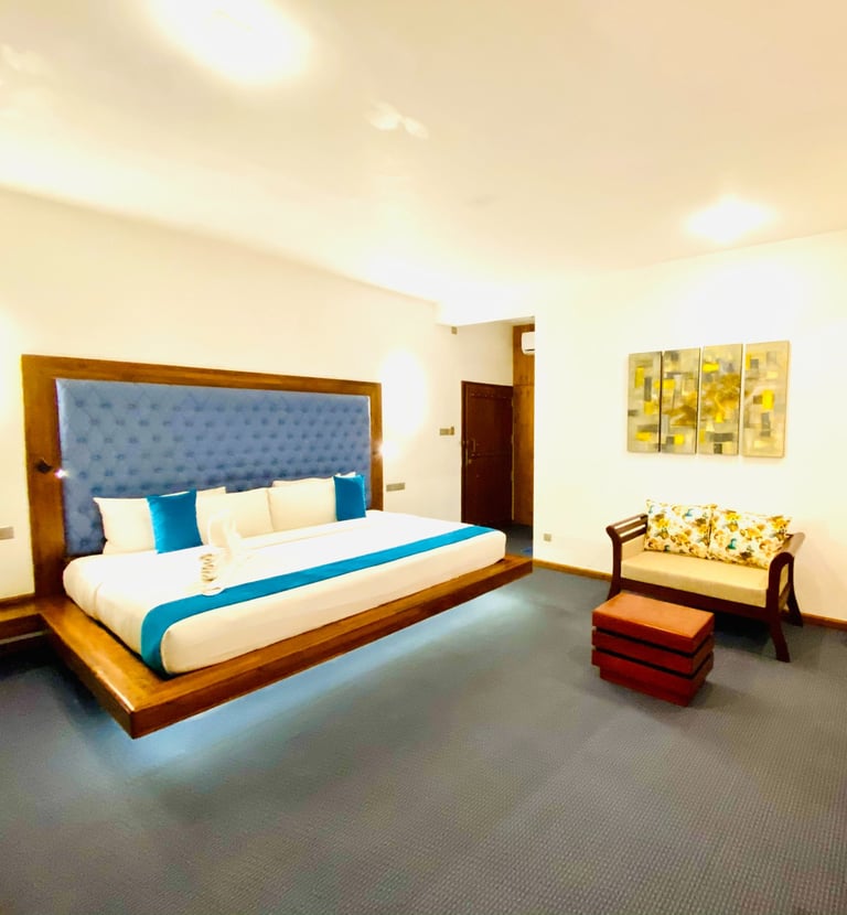 a bedroom with a bed and a desk