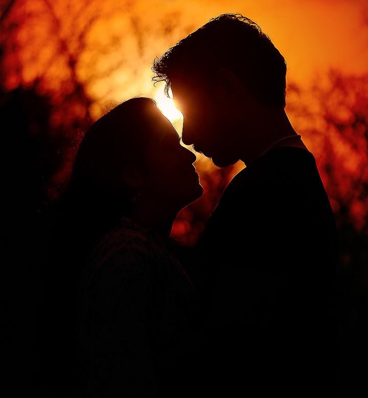 Silhouette photograph of a couple in evening sky