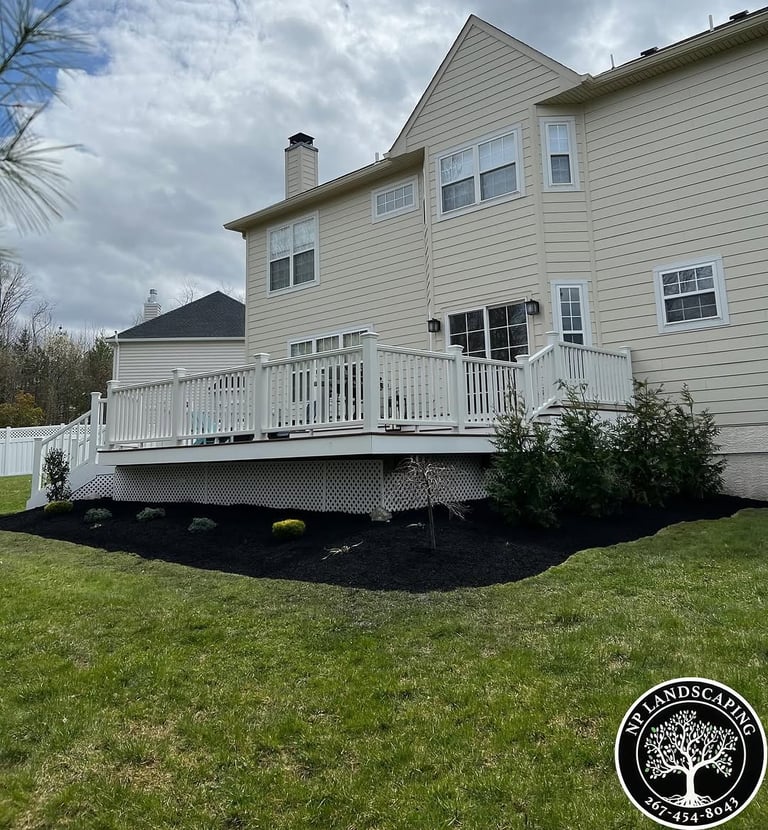 excellent landscaping and hardscaping of grass, stones and trees by NP Landscaping