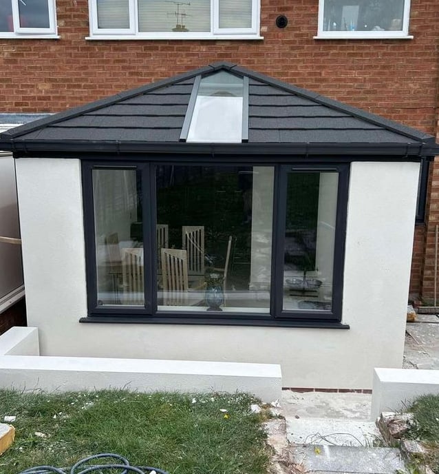 Rendered wall detail showing a seamless finish on an outdoor extension.