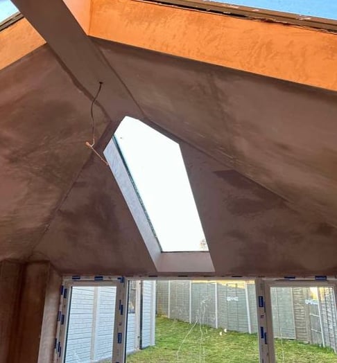 Plastering work done on a residential interior ceiling.