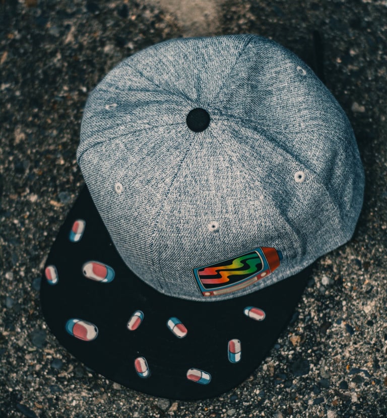 a hat with pills and pills on it