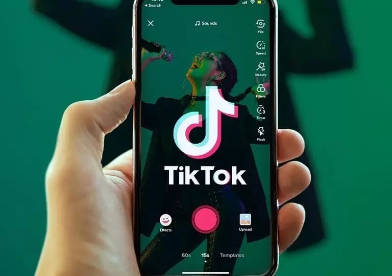 a person holding a phone with the tik tok