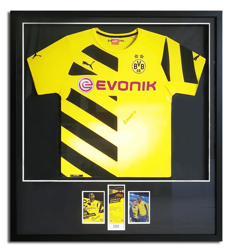 A framed featuring a signed Borussia Dortmund jersey
